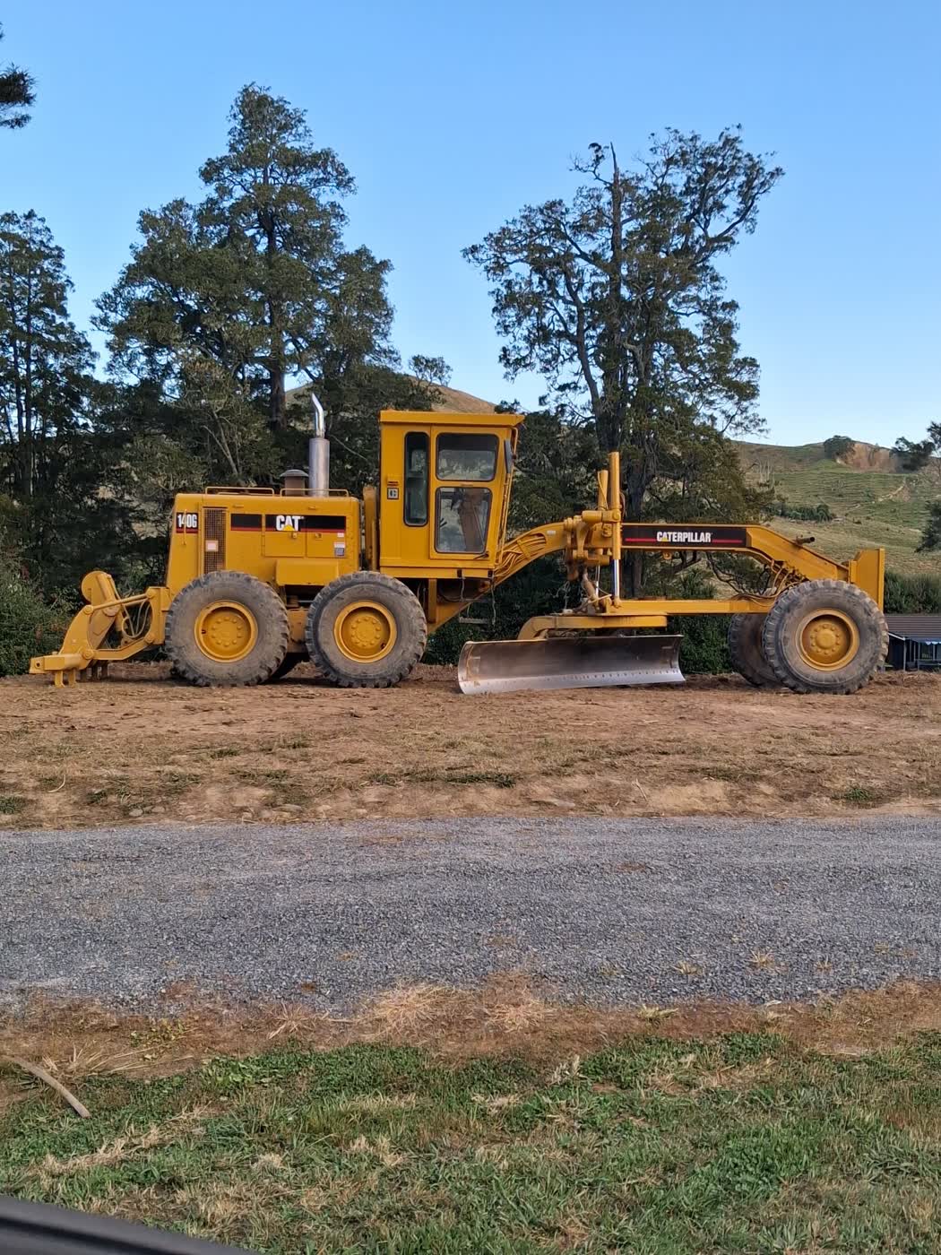 Caterpillar 140G grader on a shaped rural building platform